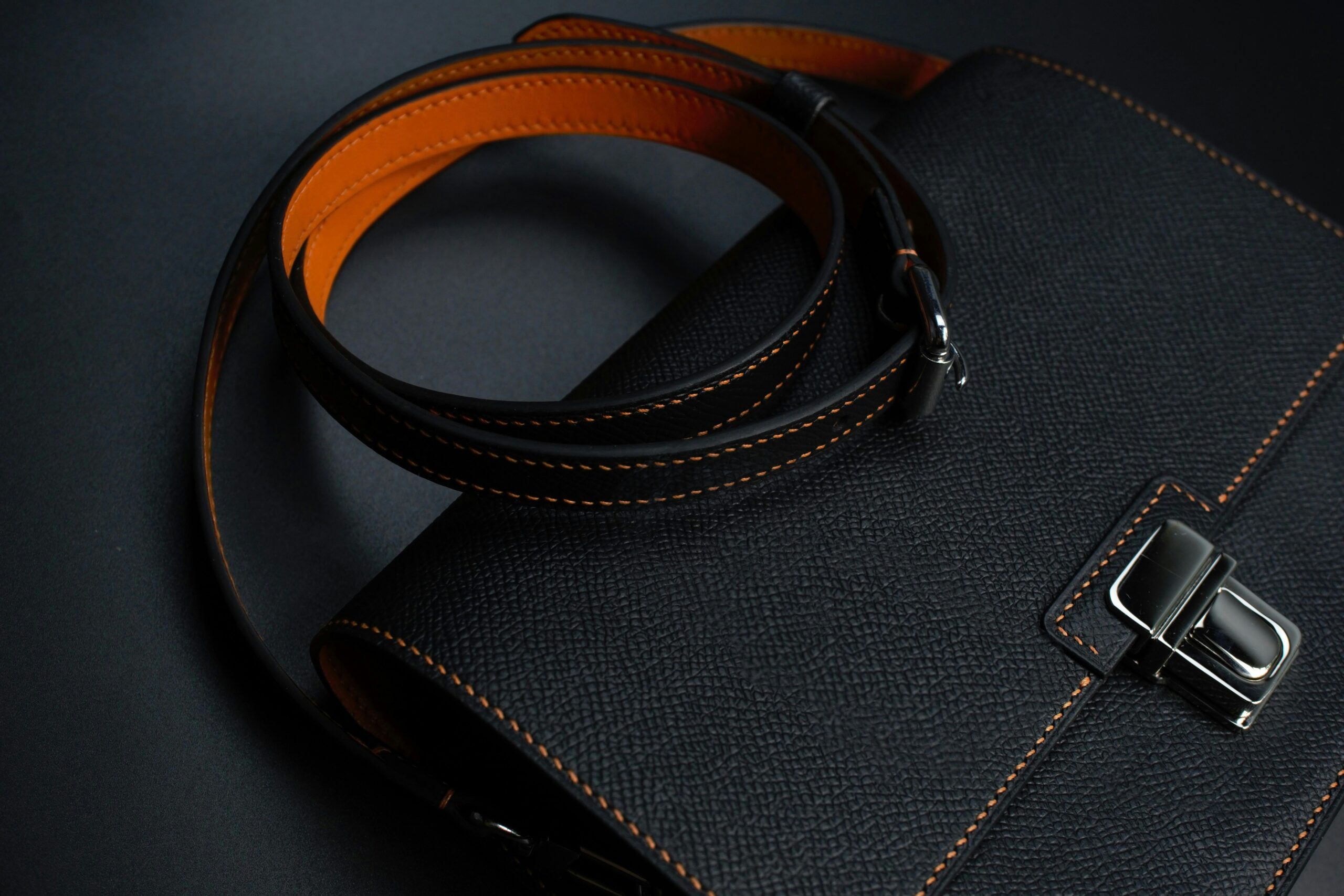 Closeup image of custom-designed durable bag tag featuring bright colors and engraving