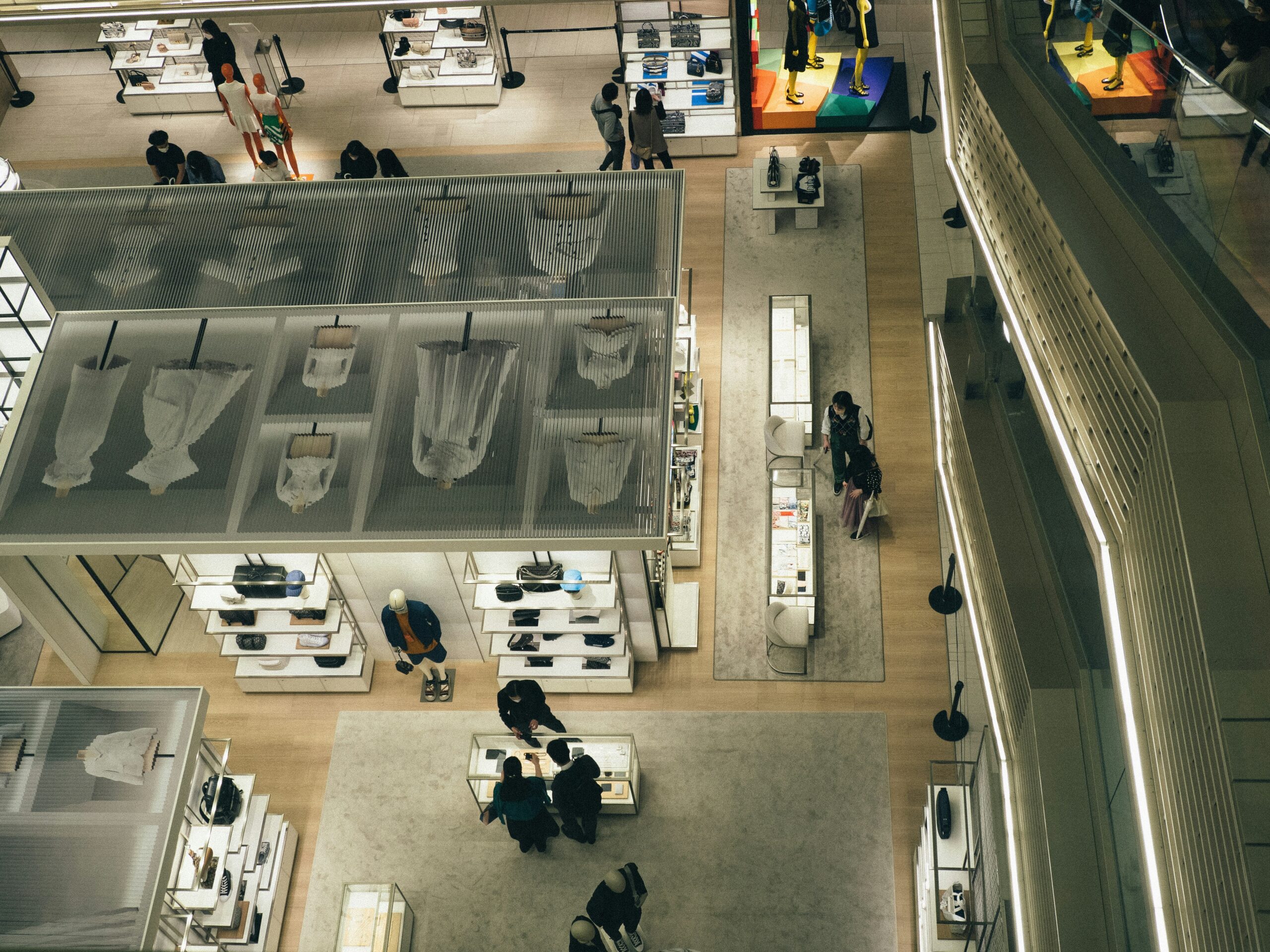 A photo showing chaotic airport baggage claim scene with frustrated passengers.
