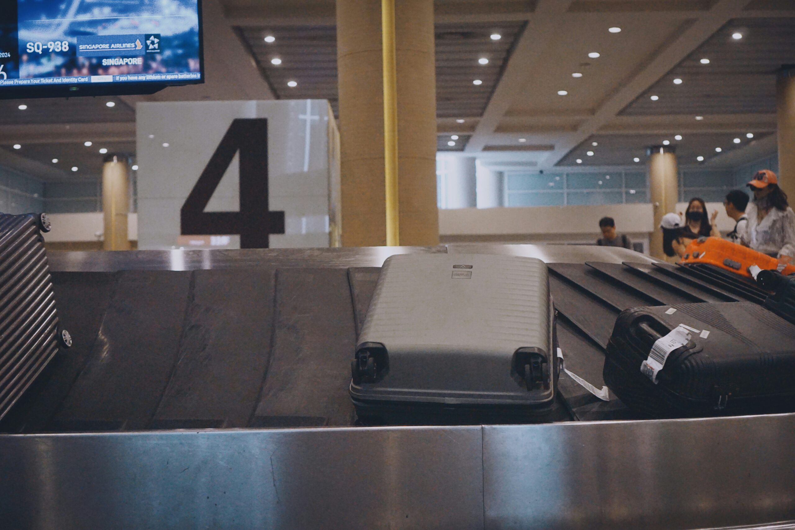 Passport, boarding pass, and other travel documents laid out neatly
