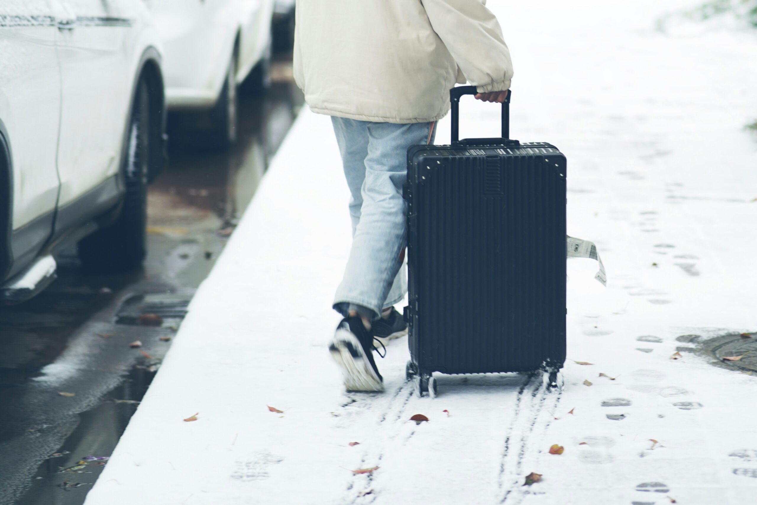 Travelers waiting anxiously at an airport baggage carousel