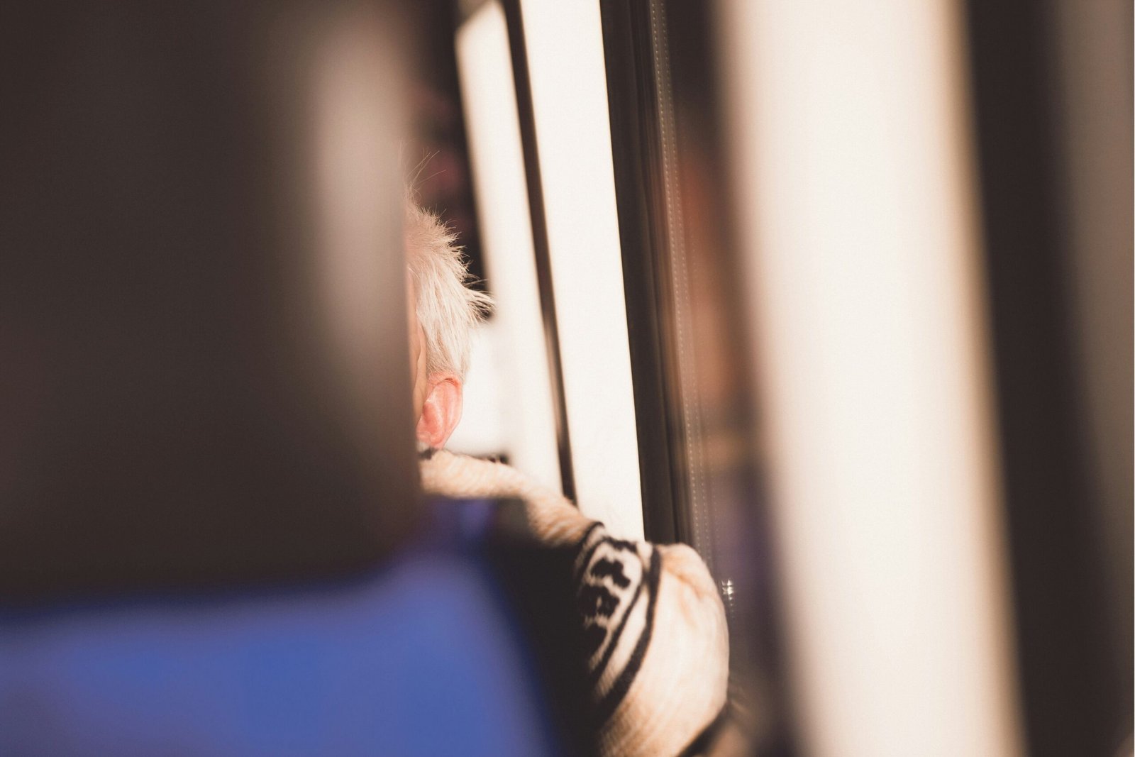 A close-up shot of someone filling out a baggage claim form at an airport counter
