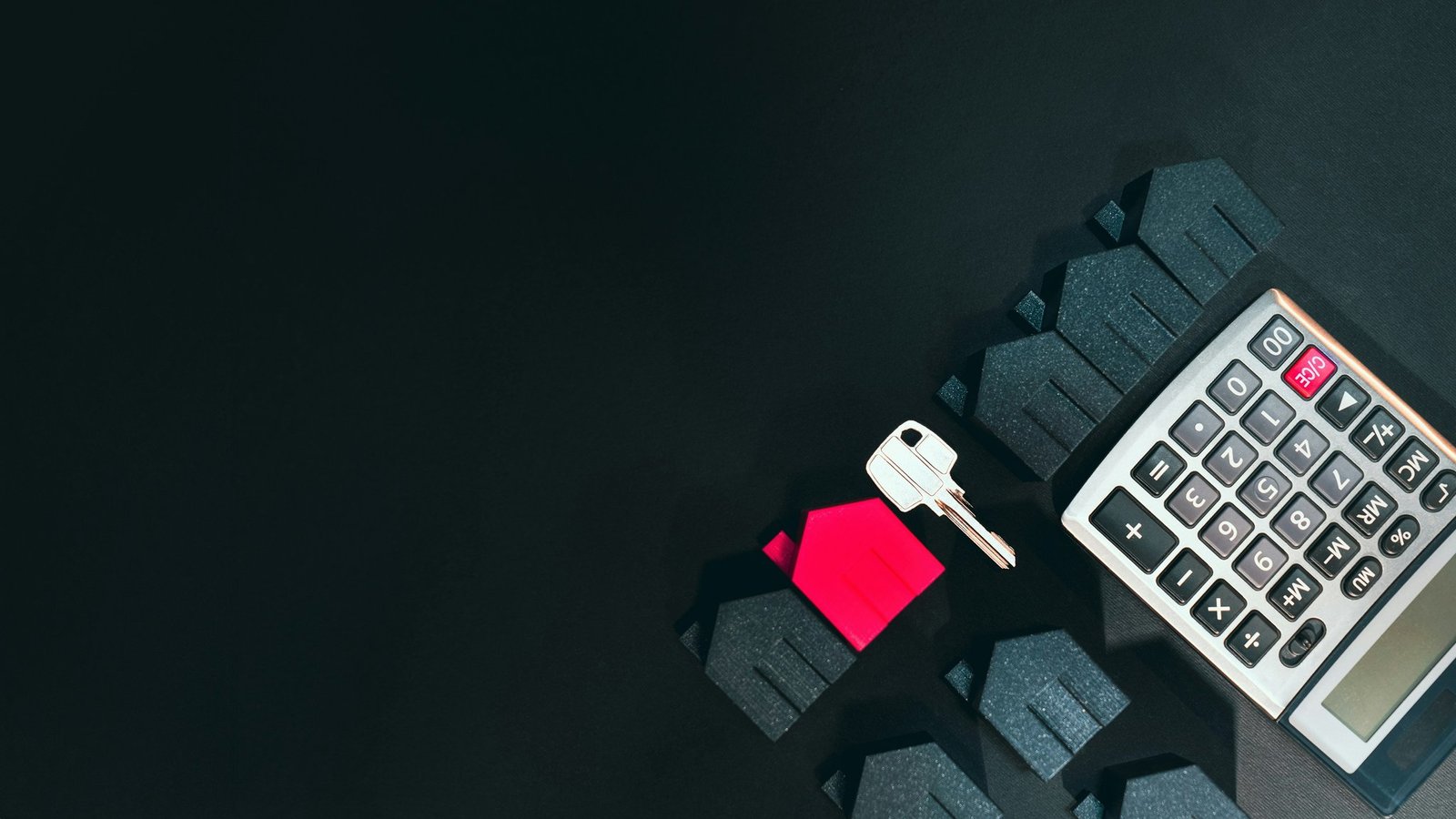 A traveler looking frustrated next to an empty baggage carousel at an airport.