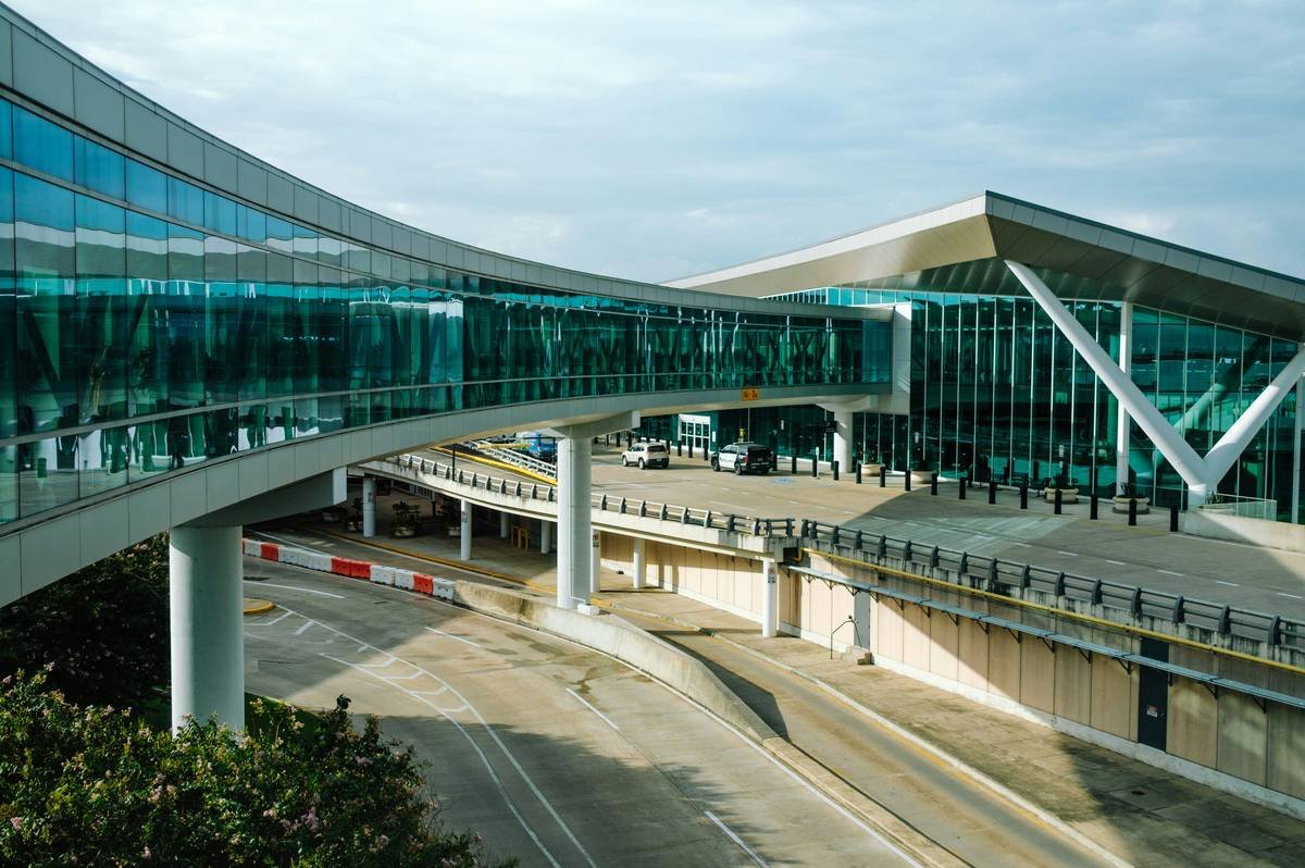 A busy airport baggage carousel filled with suitcases